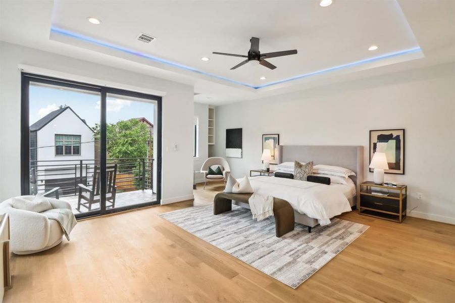 The primary bedroom is an amazing space! LED lighting is tucked away in the coffered ceiling, there is a sitting nook & and outdoor veranda. Facing East, it is a lovely place for early morning coffee.