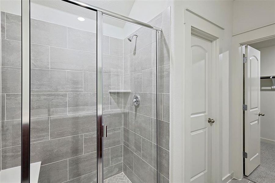 Bathroom with a shower with door