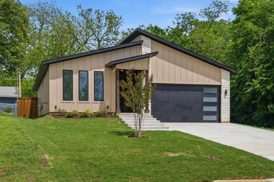 Front exterior of a new home in , Denison, TX, highlighting curb appeal (Image 21).
