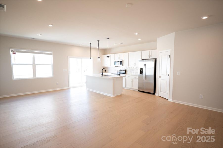 Dining and kitchen spaces well connected for functional flow.