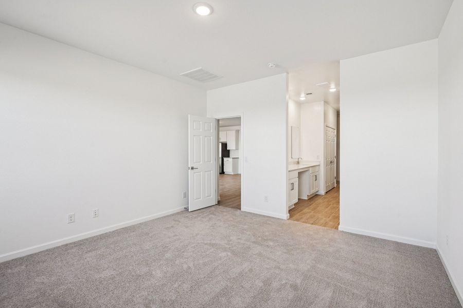 Primary suite. Options and finishes may vary by community