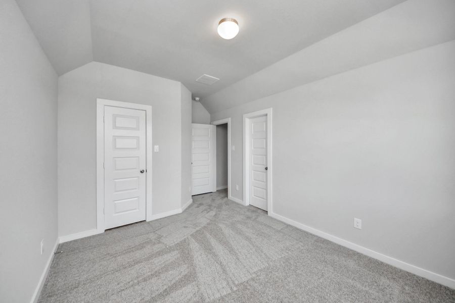 Generously sized secondary bedrooms featuring spacious closets, soft and inviting carpeting underfoot, large windows allowing plenty of natural light, and the added touch of privacy blinds for your personal retreat. Sample photo of completed home with similar floor plan. Actual colors and selections may vary.