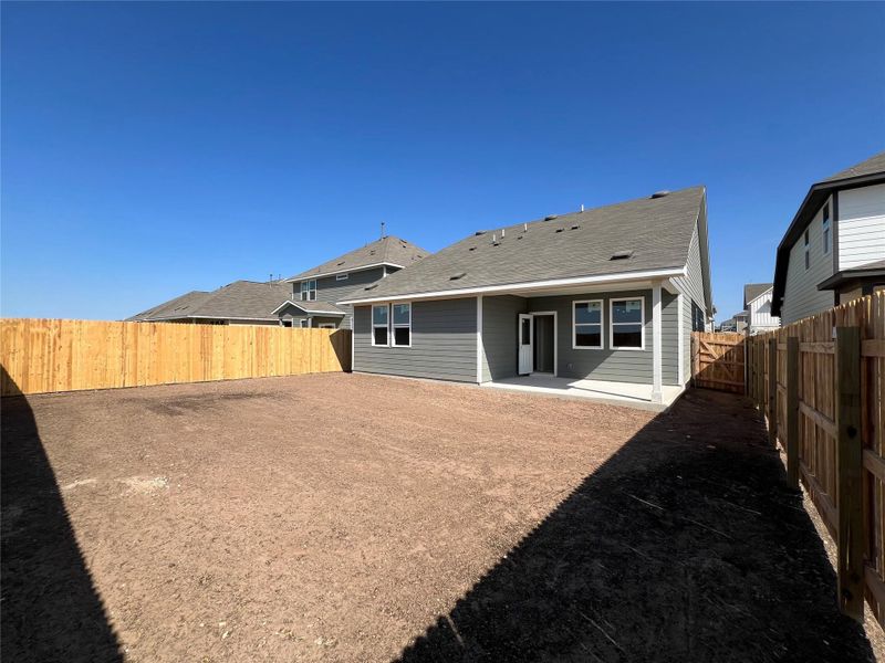 Exterior details and patio area of a home in Rolling Glen, Hutto (Image 12).
