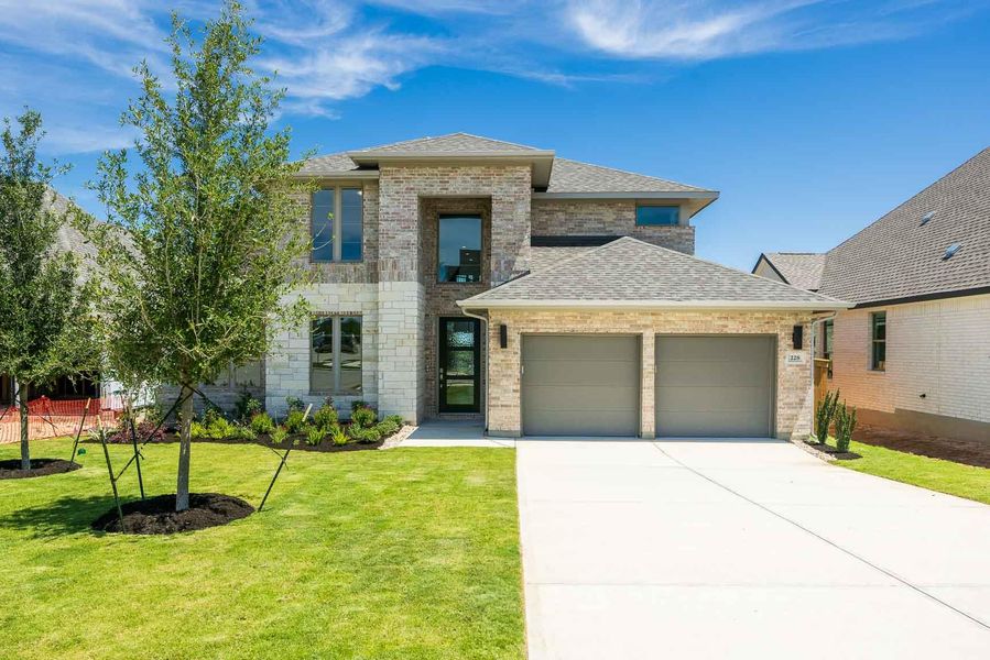 View of front of house with a garage, a front yard, a shingled roof, concrete driveway, and brick siding View of front of house with a garage, a front yard, a shingled roof, concrete driveway, and brick siding