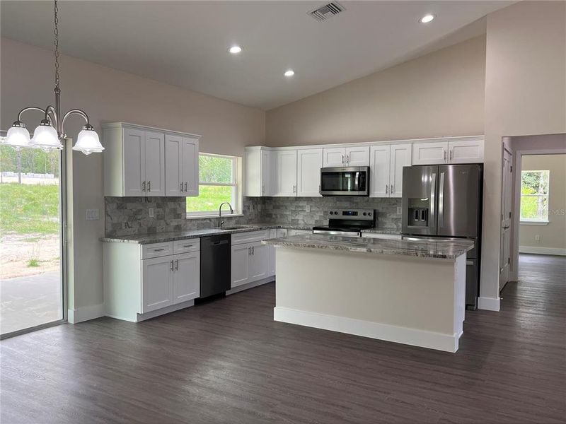 kitchen with granite countertops, stainless steel appliances and backsplash kitchen with granite countertops, stainless steel appliances and backsplash