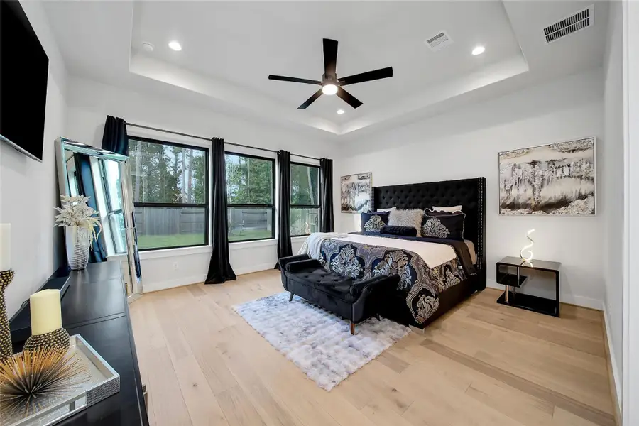 Furnished interior view inside a new home in ARTAVIA, Conroe (Image 38).