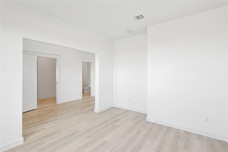 Empty room featuring light hardwood / wood-style floors