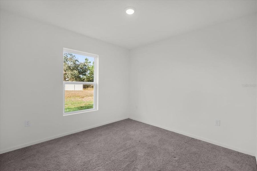 Spacious, unfurnished interior of a new home in Poinciana Village, Kissimmee (Image 22).