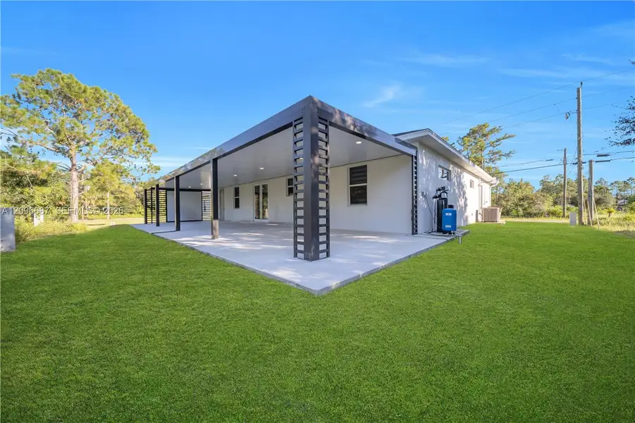Exterior details and patio area of a home in , Lehigh Acres (Image 4).