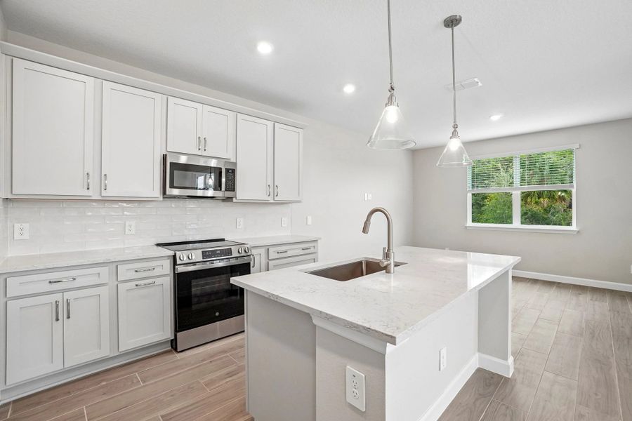From there you enter into the stunning kitchen feature AW Collection® Milan