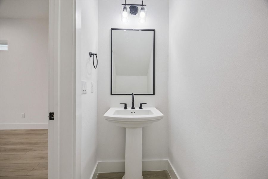 Elegant powder bath with clean contemporary finishes Elegant powder bath with clean contemporary finishes