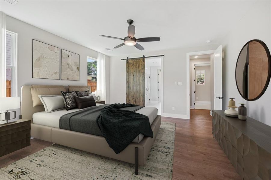 Bedroom with a barn door, engineered hardwood floors, and ceiling fan