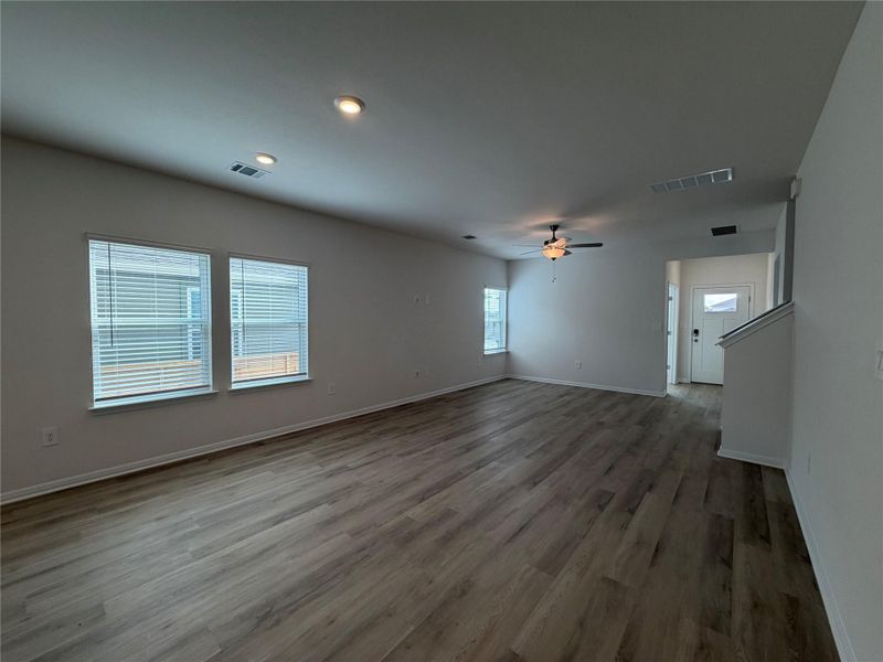 Unfurnished living room with light wood-style floors, recessed lighting, and a ceiling fan
