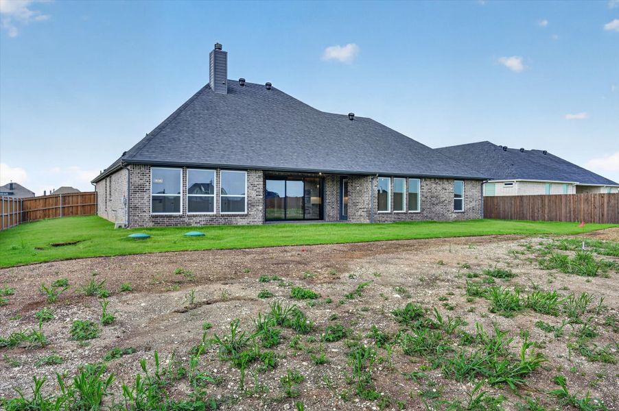 Front exterior of a new home in Coyote Crossing, Godley, TX, highlighting curb appeal (Image 22). Front exterior of a new home in Coyote Crossing, Godley, TX, highlighting curb appeal (Image 22).