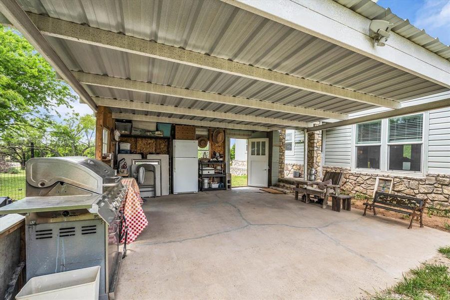 Under carport, providing extra storage, parking and patio space