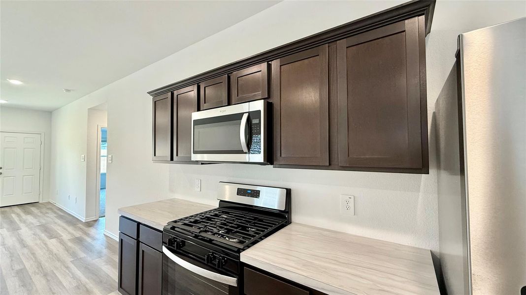 All stainless steel appliances convey with the sale.