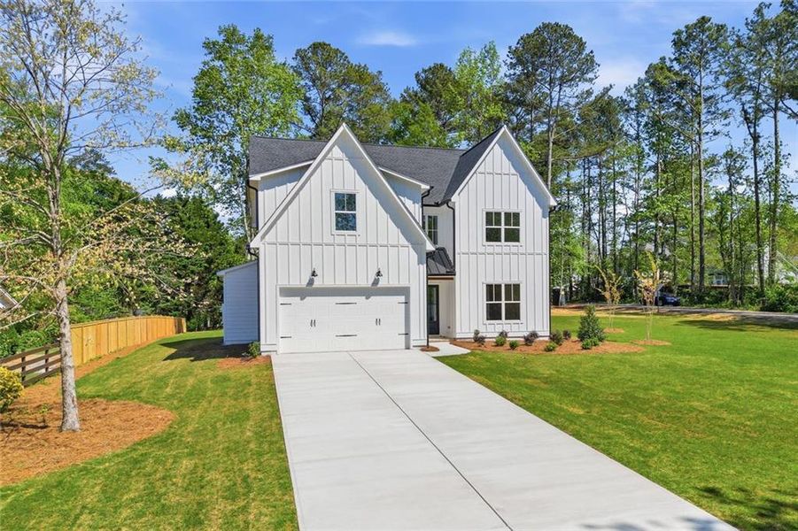 Front exterior of a new home in , Marietta, GA, highlighting curb appeal (Image 27). Front exterior of a new home in , Marietta, GA, highlighting curb appeal (Image 27).