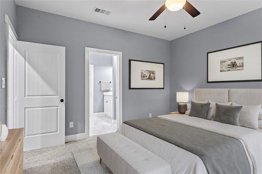Bedroom with light carpet, connected bathroom, and ceiling fan Bedroom with light carpet, connected bathroom, and ceiling fan