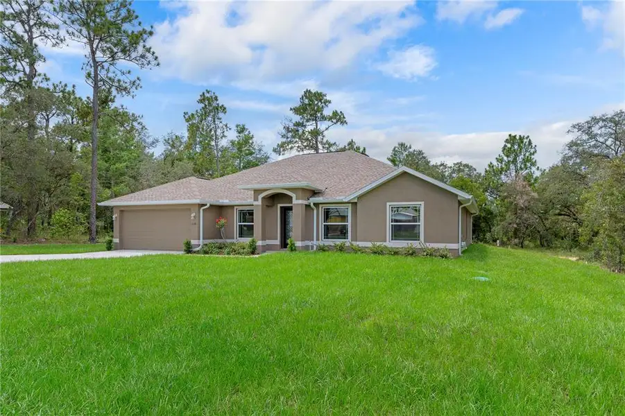 Front exterior of a new home in , Weeki Wachee, FL, highlighting curb appeal (Image 1). Front exterior of a new home in , Weeki Wachee, FL, highlighting curb appeal (Image 1).