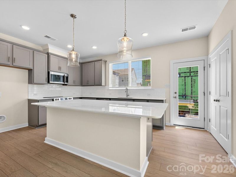 Furnished interior view inside a new home in Central Living at Craig, Charlotte (Image 9).
