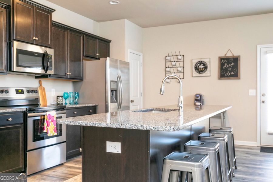 Furnished interior view inside a new home in Cobblestone Crossing Commons, Byron (Image 12).