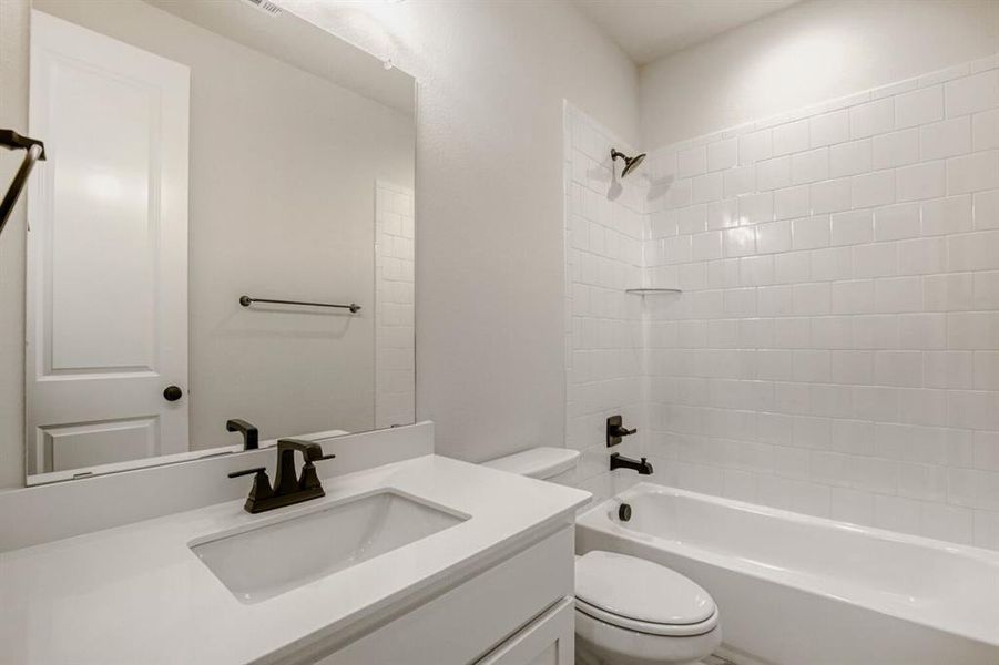Full bath with vanity and bathtub / shower combination