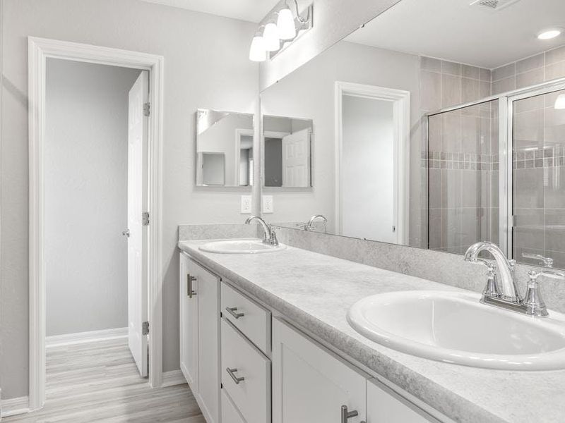 Your suite is complete with a walk-in wardrobe and dual-vanity en-suite bath - Blakely by Highland Homes Your suite is complete with a walk-in wardrobe and dual-vanity en-suite bath - Blakely by Highland Homes