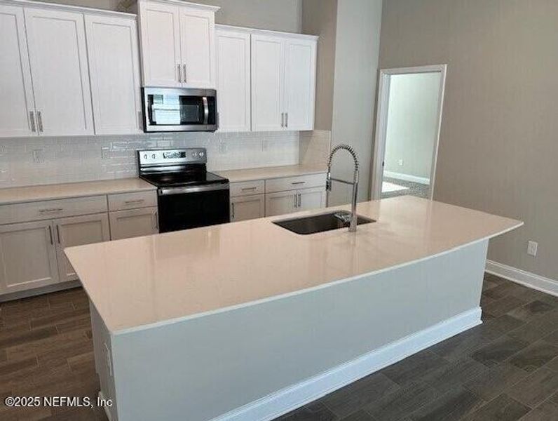 Furnished interior view inside a new home in Sawmill Branch, Palm Coast (Image 28).