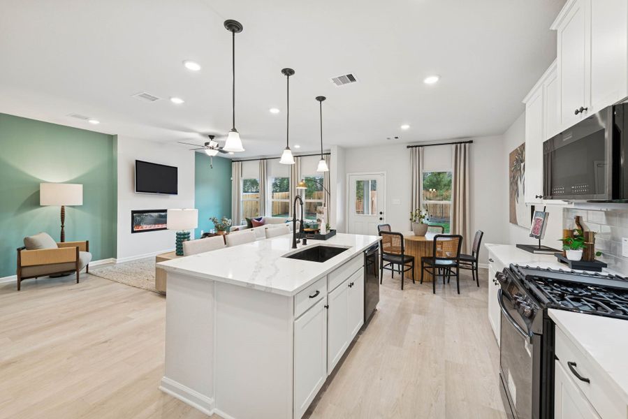 The Princeton II- Kitchen into the Family Room. Staged model home shown for illustration only; actual features, colors, and upgrades may vary. The Princeton II- Kitchen into the Family Room. Staged model home shown for illustration only; actual features, colors, and upgrades may vary.
