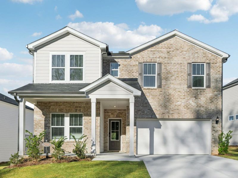 Front exterior of a new home in Vines at Mill Creek - Estate Series, Braselton, GA, highlighting curb appeal (Image 1).