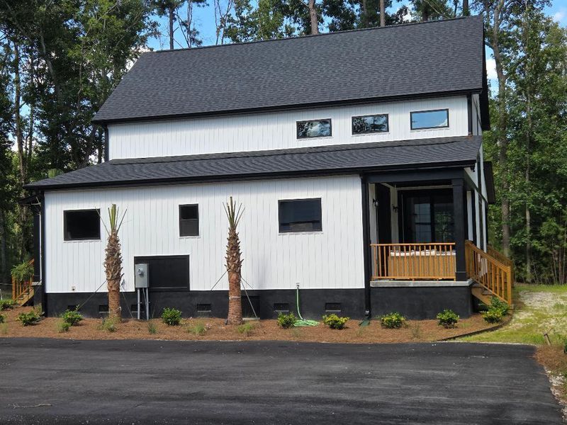 Front exterior of a new home in , Meggett, SC, highlighting curb appeal (Image 2). Front exterior of a new home in , Meggett, SC, highlighting curb appeal (Image 2).