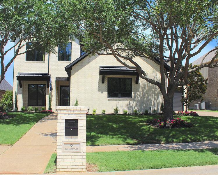 Front exterior of a new home in , Heath, TX, highlighting curb appeal (Image 1).
