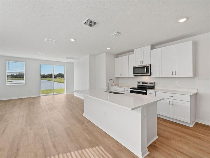 Furnished interior view inside a new home in Oakfield Trails - Premier Series, Parrish (Image 4).
