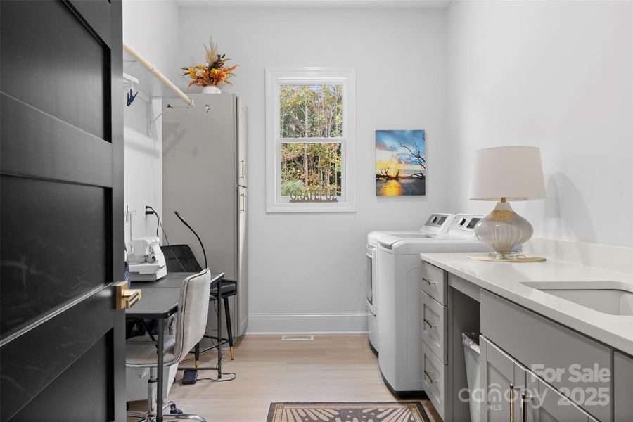 Laundry room with built ins and room for art and craft projects. Laundry room with built ins and room for art and craft projects.