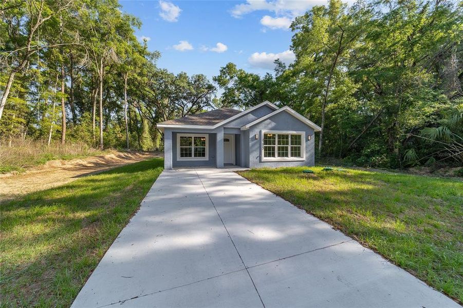 Front exterior of a new home in , Belleview, FL, highlighting curb appeal (Image 24).