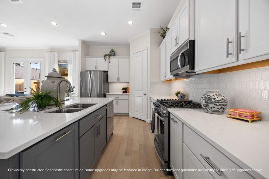 Spacious, seamless, and oh-so-stylish. With generous storage, a walk-in pantry, and effortless flow, this kitchen is ready for whatever the day brings. Final selections were made by LYRD Interiors and may vary.
