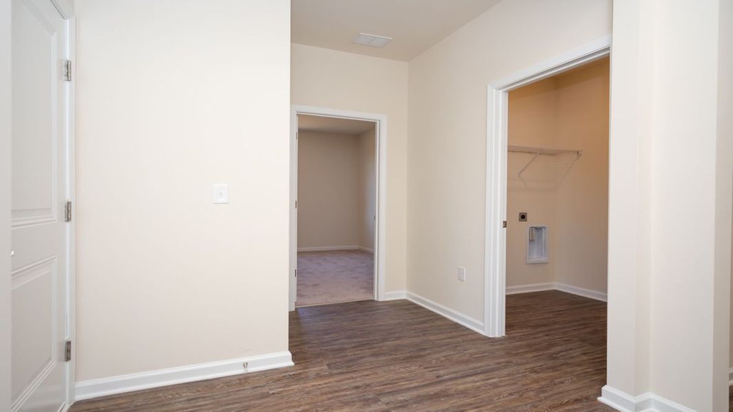 Representative unfurnished interior of a home built from the CALI by D.R. Horton in The Reserve at Wild Horse, Conway (Image 17).