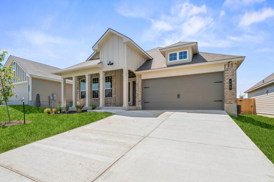 Front exterior of a new home in The Village at Elm Creek, Troy, TX, highlighting curb appeal (Image 2). Front exterior of a new home in The Village at Elm Creek, Troy, TX, highlighting curb appeal (Image 2).