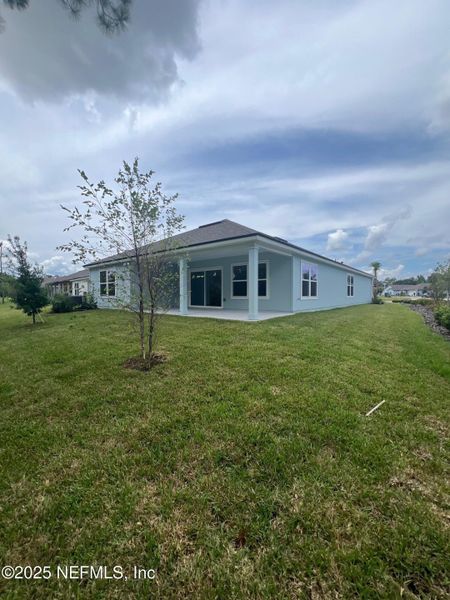 Front exterior of a new home in American Village, Palm Coast, FL, highlighting curb appeal (Image 19). Front exterior of a new home in American Village, Palm Coast, FL, highlighting curb appeal (Image 19).