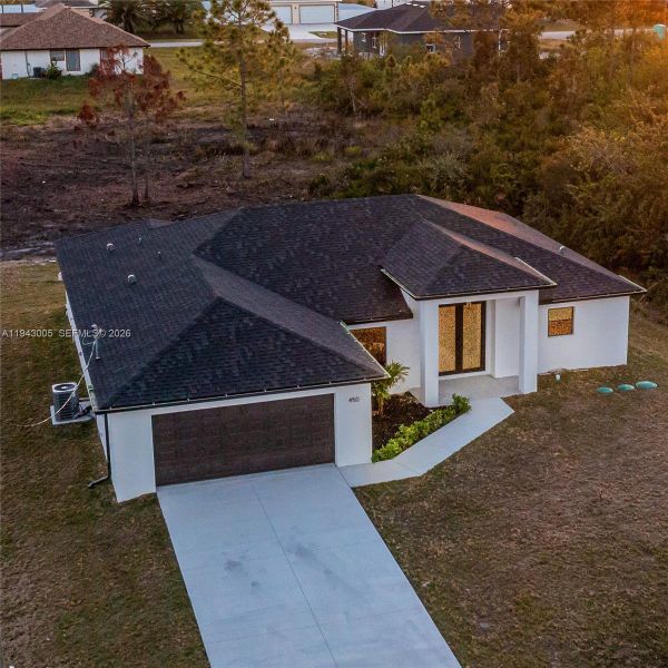 Front exterior of a new home in , Lehigh Acres, FL, highlighting curb appeal (Image 19). Front exterior of a new home in , Lehigh Acres, FL, highlighting curb appeal (Image 19).