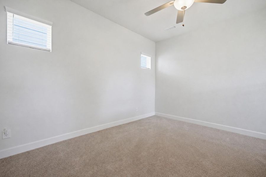Spacious, unfurnished interior of a new home in The Groves 35', Humble (Image 27).