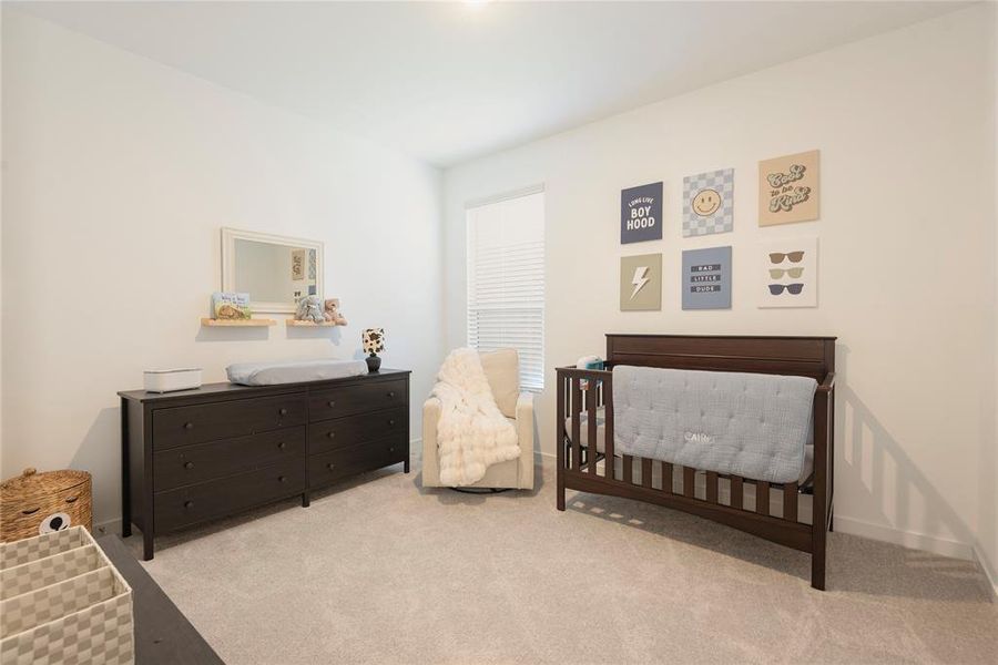 Bright room featuring light-toned carpeting and white walls Bright room featuring light-toned carpeting and white walls