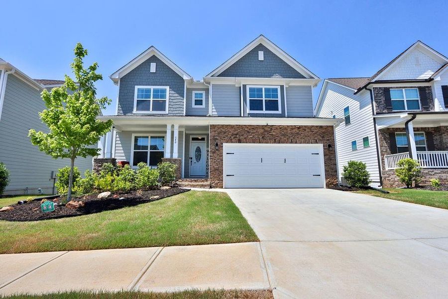 Front exterior of a new home in , Hoschton, GA, highlighting curb appeal (Image 1). Front exterior of a new home in , Hoschton, GA, highlighting curb appeal (Image 1).