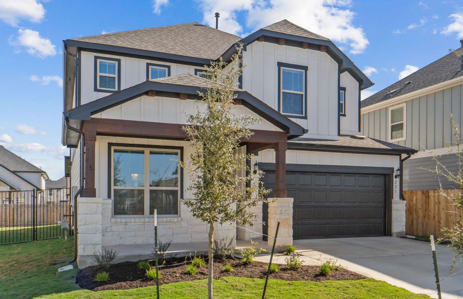 Front exterior of a new home in Santa Rita Ranch, Liberty Hill, TX, highlighting curb appeal (Image 23).