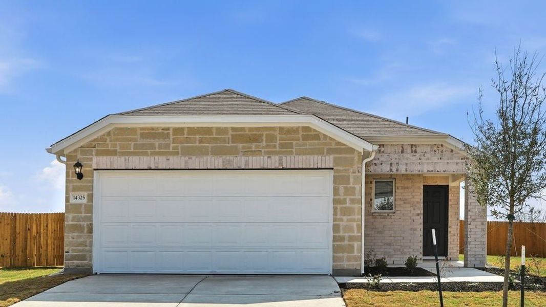 Representative exterior photo of a completed home built from the Falcon by Taylor Morrison in Stonewall Ranch, Liberty Hill, TX (Image 13).