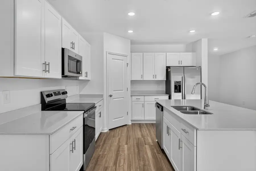 Representative furnished interior of a home built from the Kingfisher by Taylor Morrison in Palm Wind, Hudson (Image 4).