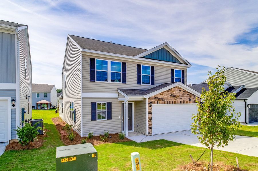 Front exterior of a new home in Bluefield, Lexington, SC, highlighting curb appeal (Image 19). Front exterior of a new home in Bluefield, Lexington, SC, highlighting curb appeal (Image 19).