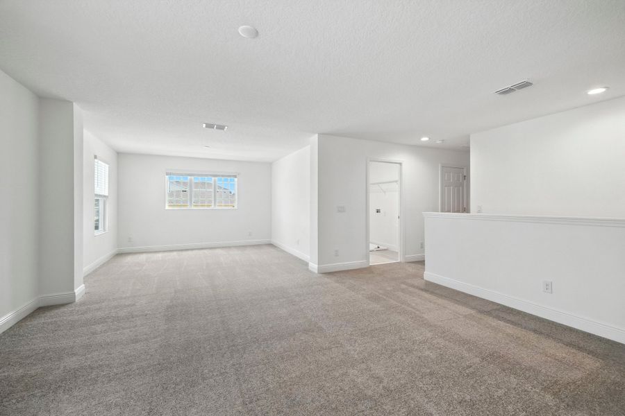 Representative unfurnished interior of a home built from the Wilshire Executive by Landsea Homes in Storey Creek, Kissimmee (Image 9).