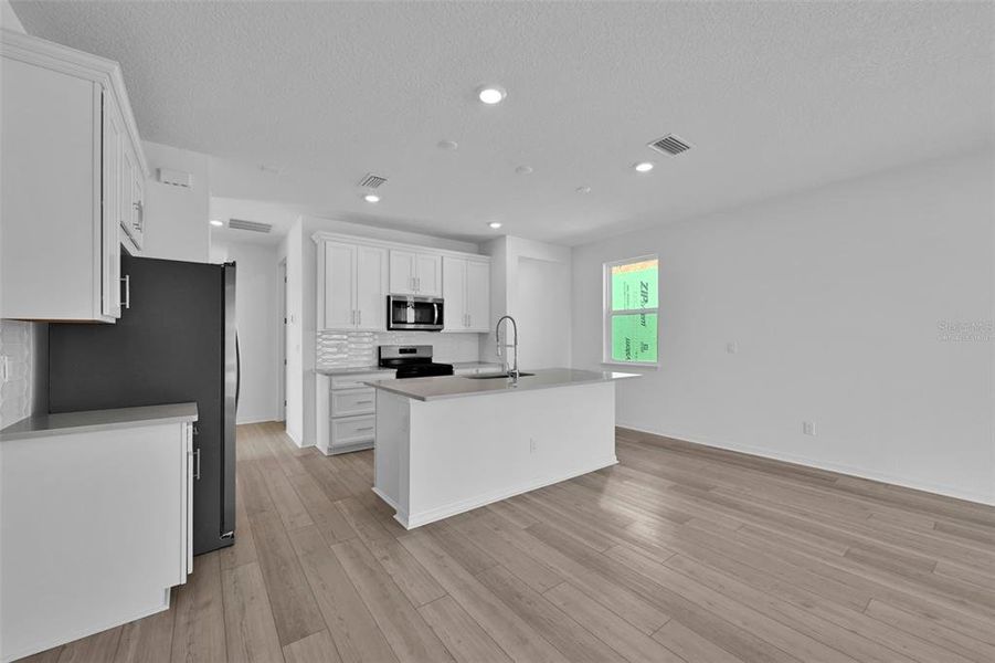Furnished interior view inside a new home in Seminole Palms, Palm Coast (Image 7). Furnished interior view inside a new home in Seminole Palms, Palm Coast (Image 7).