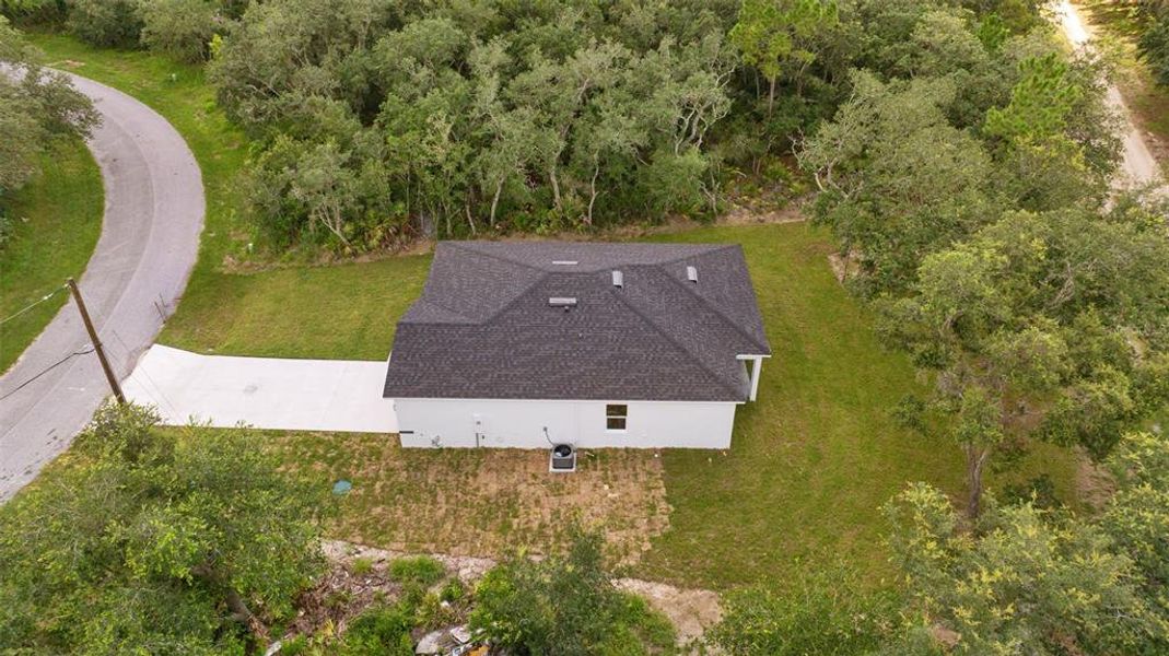 Front exterior of a new home in , Poinciana, FL, highlighting curb appeal (Image 21).